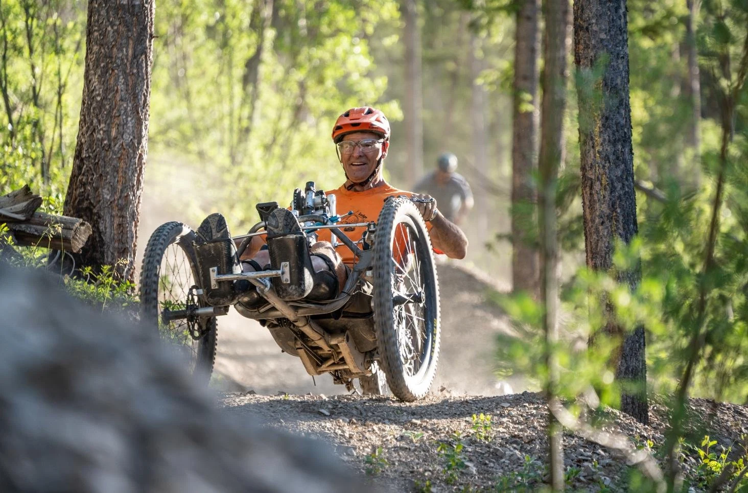 Adaptive cyclist riding a woodland trail