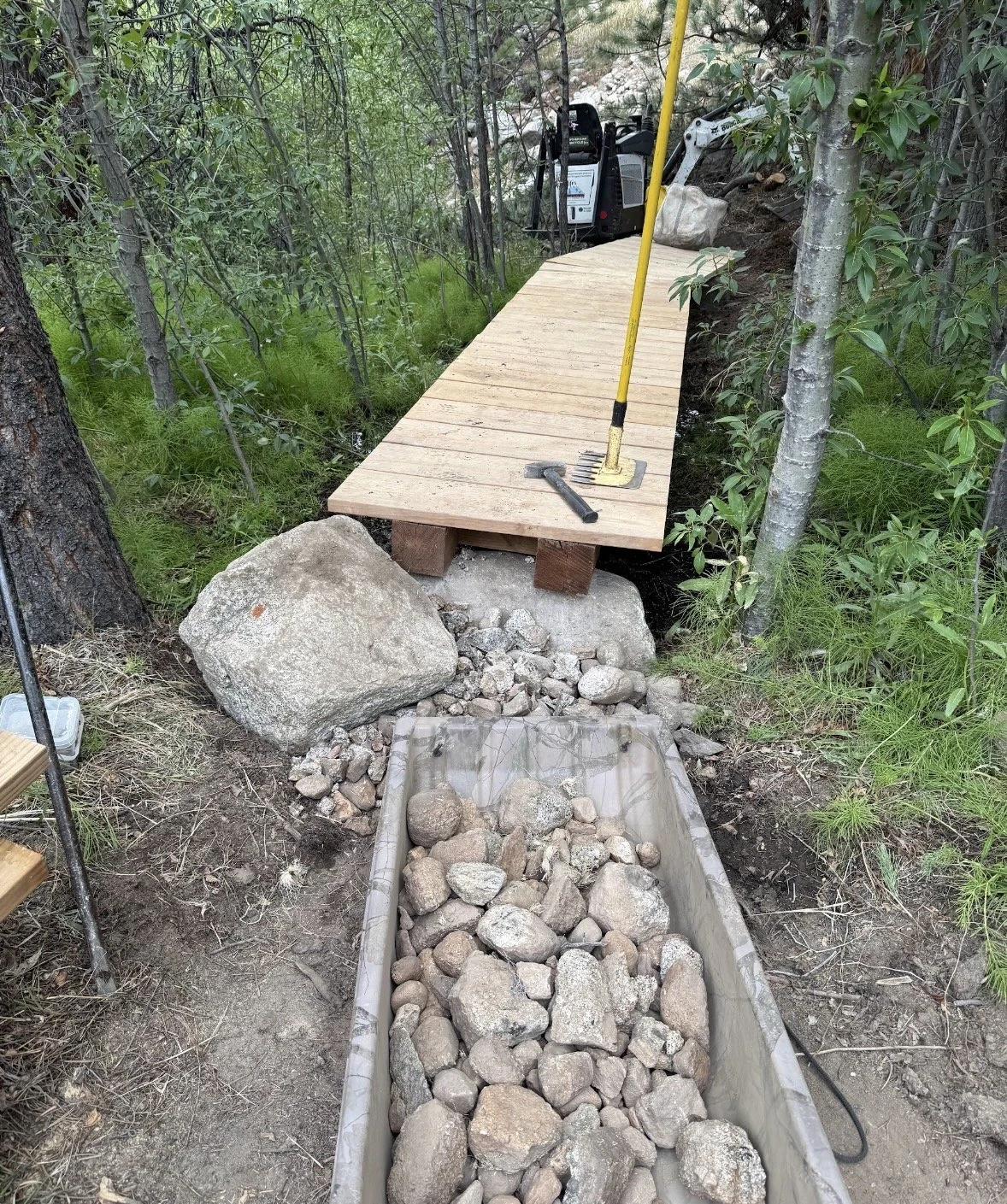 Wooden Twin Lakes Connector bridge and stone-armored approach