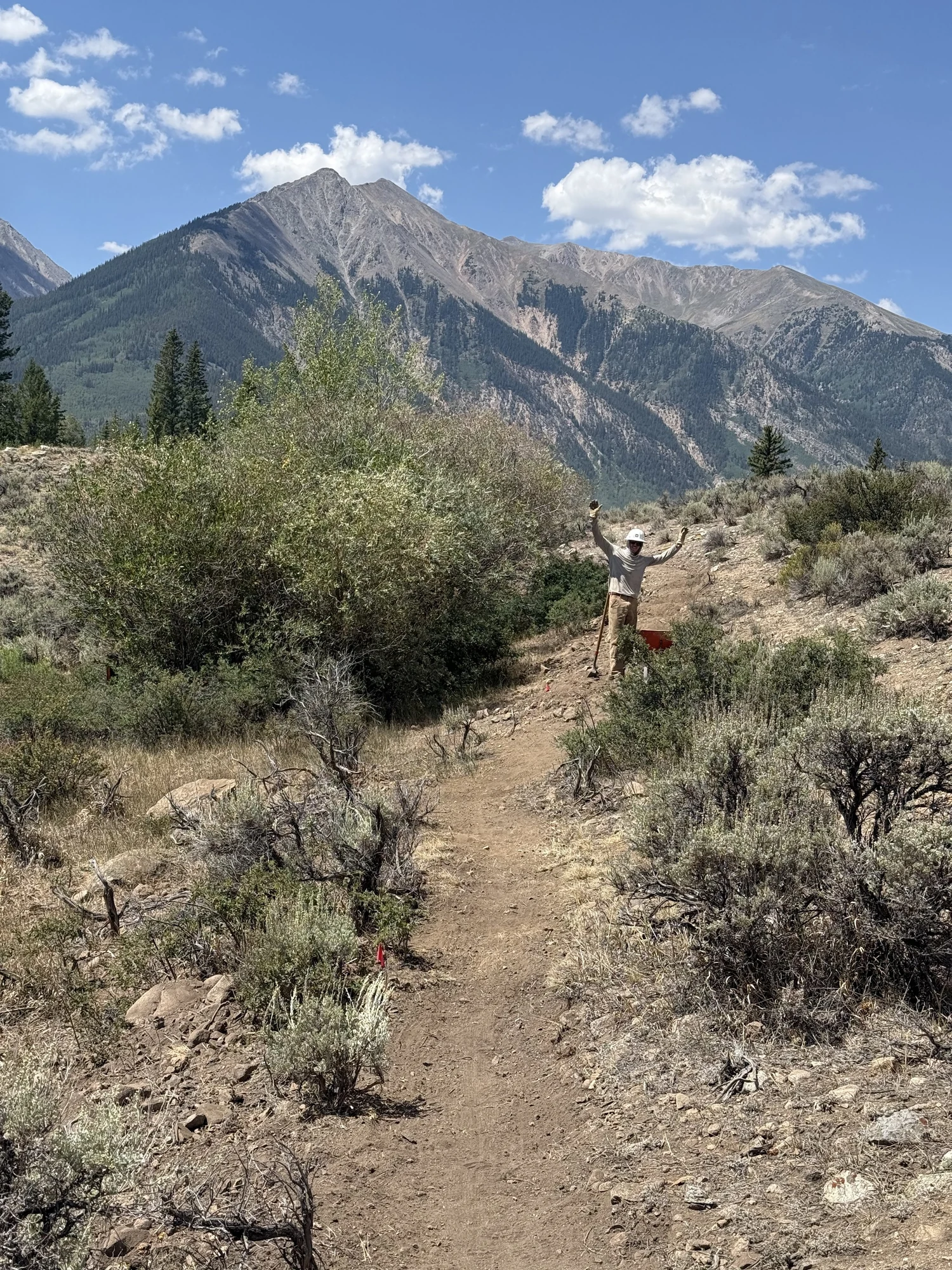 Trail work on the Twin Lakes Connector with a mountain backdrop